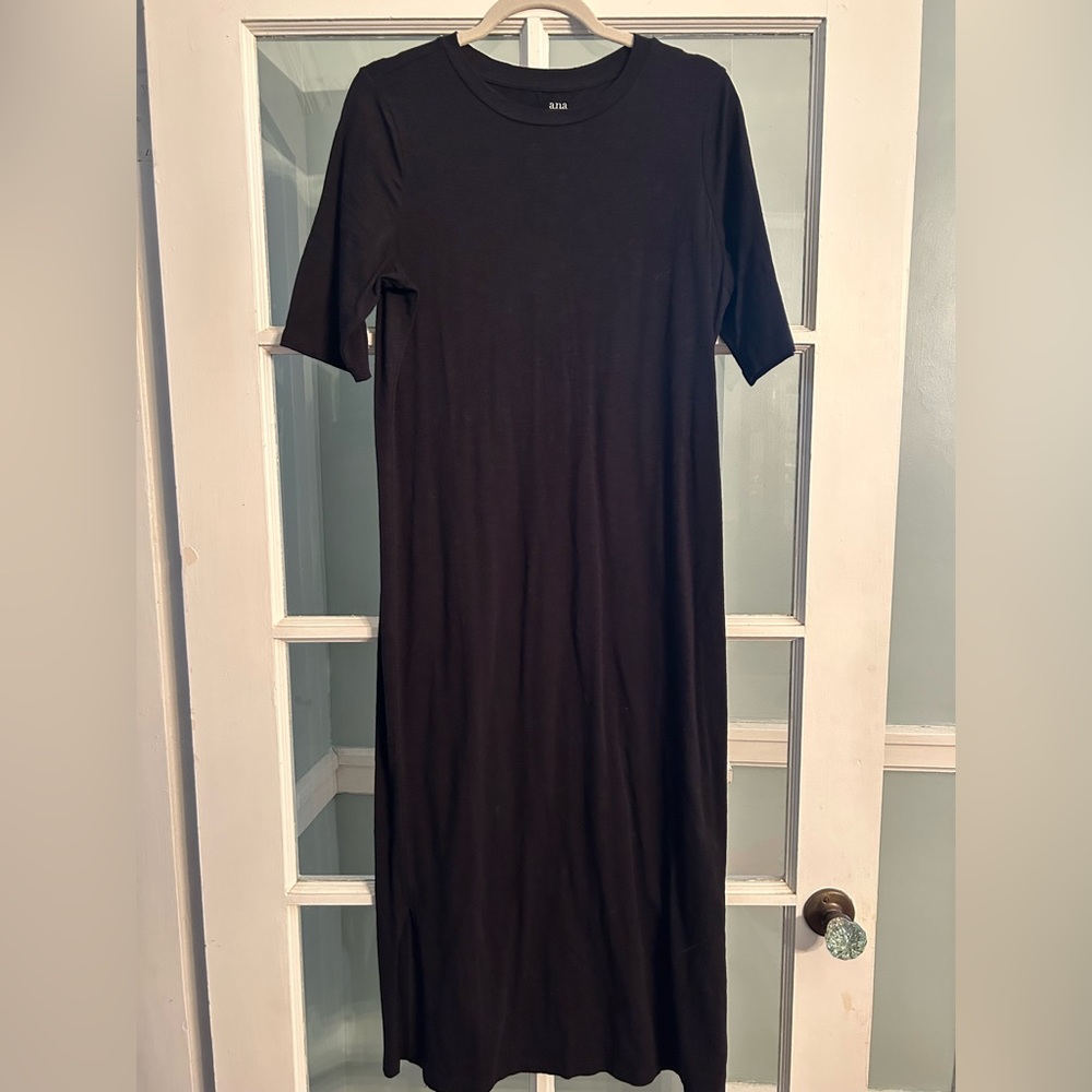 Long black dress. Quarter length sleeves